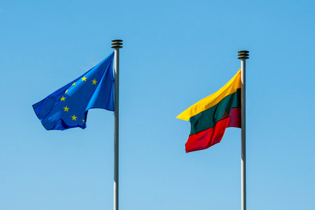 Red,yellow and green Lithuania flag waving side by side with European Union flag with dark blue with yellow starの写真素材