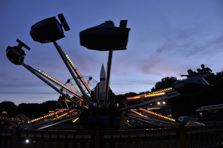 Funfair, travelling fairground ride at dusk.の写真素材