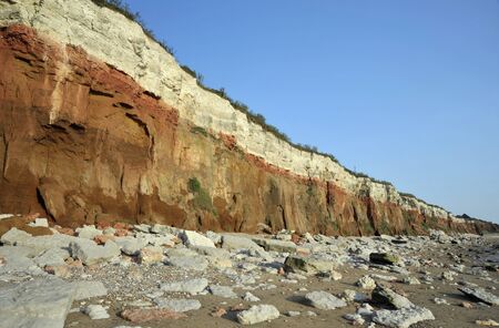 The cliffs, beach and bedrock outcrops along the coast at Hunstanton in Norfolk, UK.の写真素材