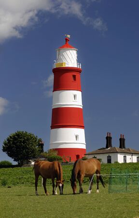 Happisburgh lighthouse on the North Norfolk coast, built in 1790, is the only independently operated lighthouse in Great Britain.の写真素材