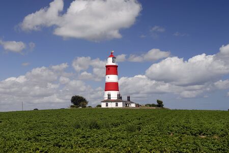 Happisburgh lighthouse on the North Norfolk coast, built in 1790, is the only independently operated lighthouse in Great Britain.の写真素材