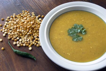 Indian Dahl soup with dried yellow split peas and a green chilli.