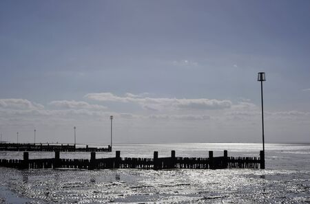 Low tide beach landscape at Heacham on the Norfolk coast.の写真素材