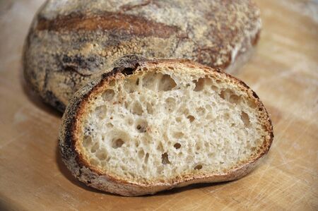 Homemade artisan round white sourdough bread loaf made from natural wild yeast sourdough starter...