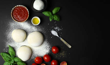 Ingredients pizza on black background. Top viewの写真素材