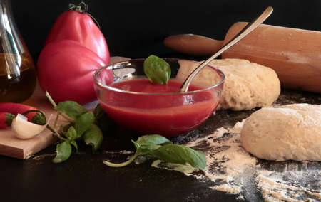 Homemade pizza. Ingredients for making italian pizza on dark background.の写真素材