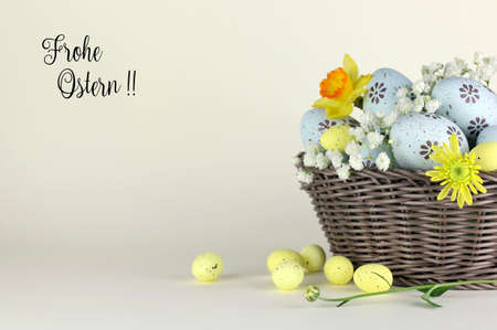 Easter eggs and flowers in basket with tag