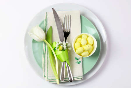 Easter table with cutlery on wooden table
