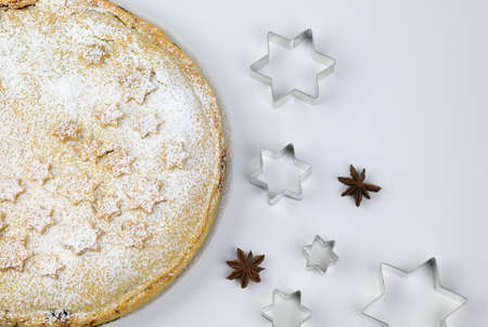 Homemade american traditional holiday pie. Apple pie dessert decorated with stars, cinnamon, red...