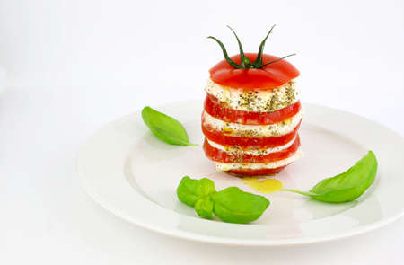 Concept of italian food. Delicious caprese salad with ripe tomatoes and mozzarella cheese with fresh...