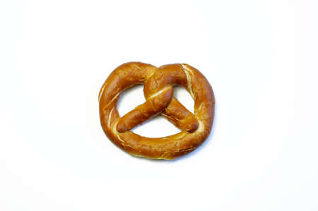 Concept of bavarian food. Traditional baked bavarian salted pretzels on white background.