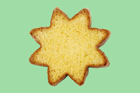 Concept of italian food.Traditional Italian Christmas Pandoro cake isolated on mint background.