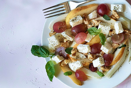Fennel salad with feta, grapes, pears and walnuts. Healthy food. Top view