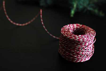 Decorative Christmas twine on dark background.の写真素材