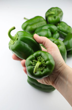 Fresh green pepper on a white background. Top view, copy space.の写真素材