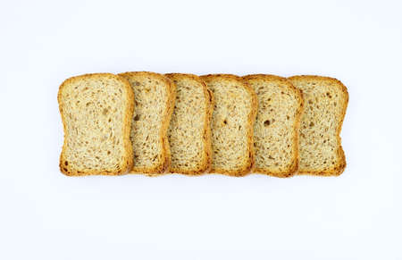 Crispy rusks isolated on white background. Top view.