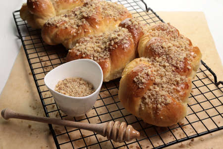 Romanian cuisine. Homemade Mucenici, traditional desserts made in the figure 8 to look like garlands, smeared with honey and chopped nuts.の写真素材