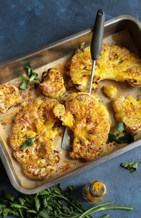 Fried cauliflower isolated on gray background. High angle view.の写真素材