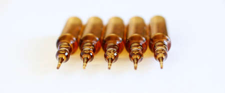 Set of transparent glass ampoules isolated on white background.の写真素材