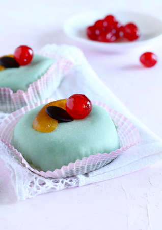 Traditional glazed sweet from Palermo, Sicily, Italy, Cassata siciliana with candied fruit, chocolate and ricotta cheese isolated on white background.の写真素材
