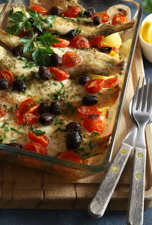 Baked sea bass fillets with cherry tomatoes and olives. Directly above.の写真素材