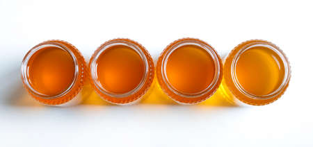 Honey pots isolated on white background. Directly above. Flat lay.の写真素材