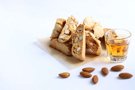 Cantucci, Italian almond cookies with sweet wine Vin Santo isolated on white background.の写真素材