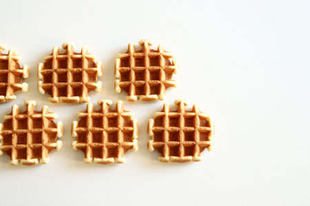Homemade waffles, Belgian breakfast pastry dessert isolated on white background. Directly above.の写真素材