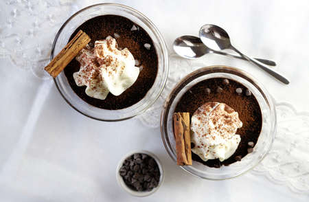Dessert concept. Top view of chocolate pudding with whipped cream.