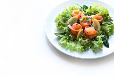 Salmon salad on white plate isolated on white background. Healthy food concept.の写真素材