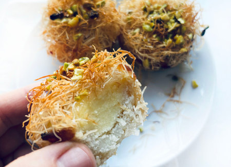 Kataifi, a typical Greek and Middle Eastern pastry specialty drizzled with honey and decorated with chopped pistachios. Kunafeh, kadenf.の写真素材