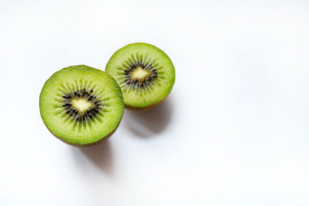 Green kiwi. Slices of fresh kiwi isolated on a white background. Healthy fruit. Overhead view.