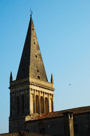 Pointy roof of a church on a cloud-free blue sky.の写真素材