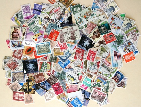 Hundreds of colorful international postage stamps