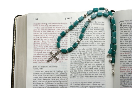 Open Bible with silver crossの写真素材