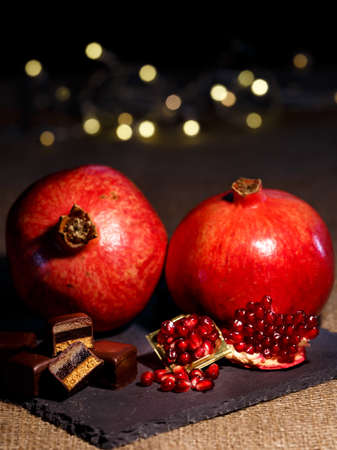 Two pomegranates with dominoesの写真素材