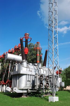 Electrical utility transformer substation over blue sky