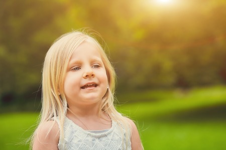 Smiling girl walking in summer dayの写真素材