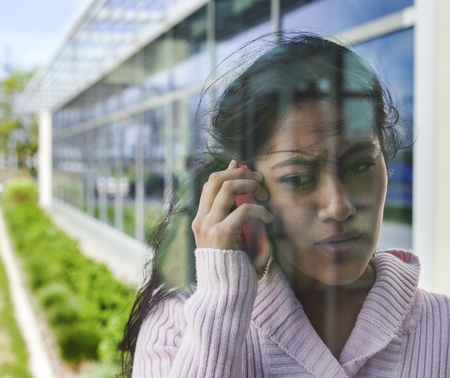 Businesswoman or student talking on phoneの写真素材