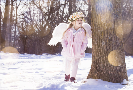 Beautiful angel girl outsideの写真素材