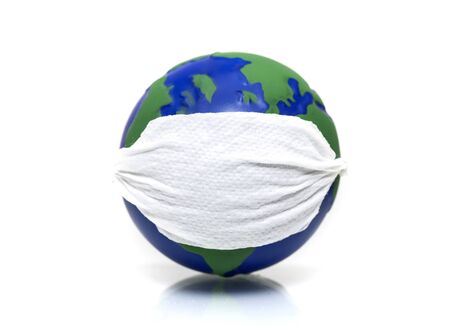 Stop corona virus. Globe with face mask on it isolated on white background.の写真素材
