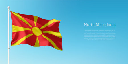Waving flag of North Macedonia on a pole with a blue sky backdrop with copyspaceのイラスト素材