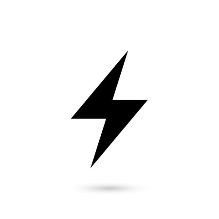 Minimalistic black lightning bolt with a subtle shadow, representing power, energy, and electricityのイラスト素材