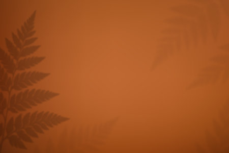 Earth-toned background with fern foliage silhouettes in soft natural light
