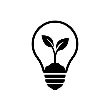 Minimal black silhouette of a plant growing in soil inside a light bulb.のイラスト素材