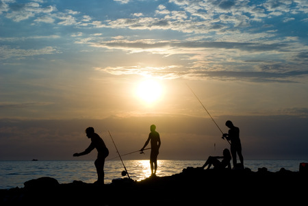 People fish  The sea, evening, the beautiful sky の写真素材