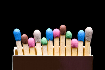 Multi-coloured matches in a box  a black background  の写真素材