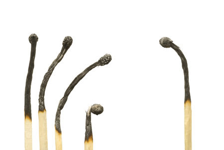 Five spoiled matches on a white background の写真素材