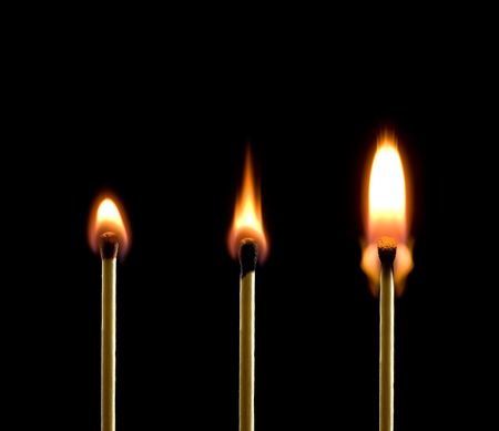 Three matches on a black background  Beautiful fire 