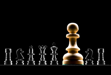 It is a lot of chessmen on a black background  are located it is horizontal  の写真素材